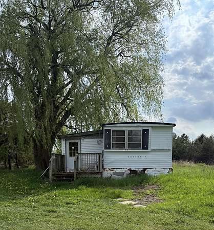 2 Acres of Residential Land with Home for Sale in Evart, Michigan