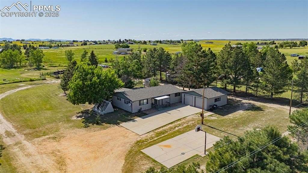 5 Acres of Residential Land with Home for Sale in Peyton, Colorado