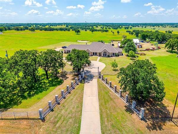 644 Acres of Agricultural Land with Home for Sale in Covington, Texas