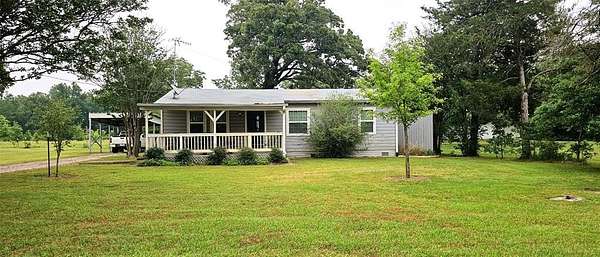 57.3 Acres of Land with Home for Sale in Hagansport, Texas