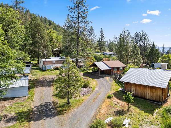 5.12 Acres of Residential Land with Home for Sale in Cave Junction, Oregon