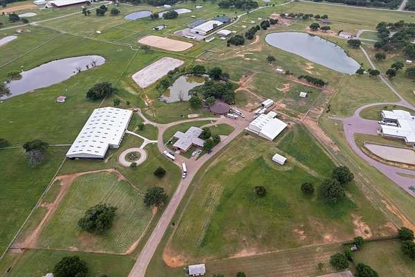 23.6 Acres of Land with Home for Lease in Pilot Point, Texas