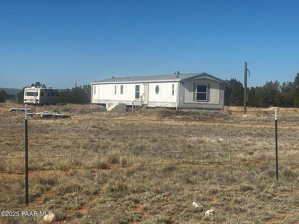 2.13 Acres of Residential Land with Home for Sale in Seligman, Arizona