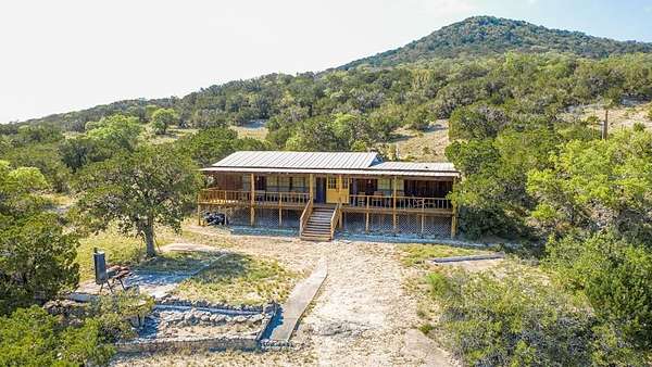 31.6 Acres of Recreational Land with Home for Sale in Utopia, Texas
