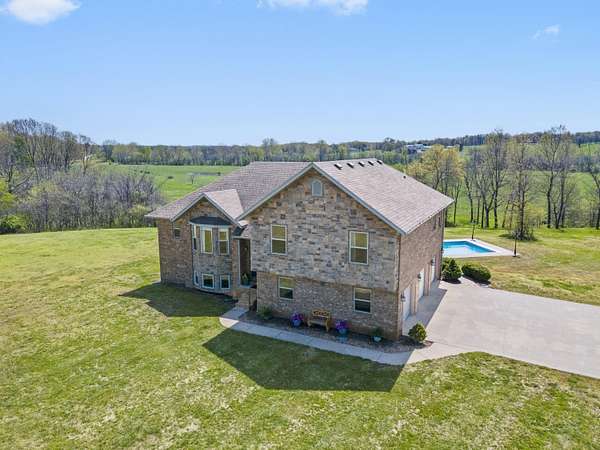 5.1 Acres of Residential Land with Home for Sale in Aurora, Missouri