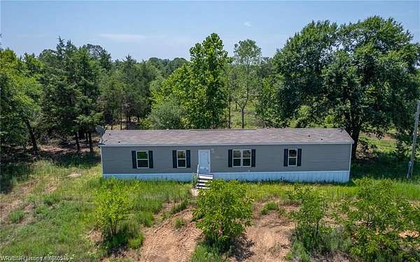 64.7 Acres of Land with Home for Sale in Muldrow, Oklahoma