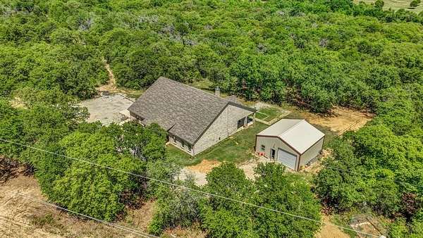 9.65 Acres of Residential Land with Home for Sale in Poolville, Texas