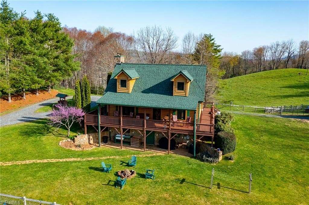 26.4 Acres of Land with Home for Sale in Crumpler, North Carolina