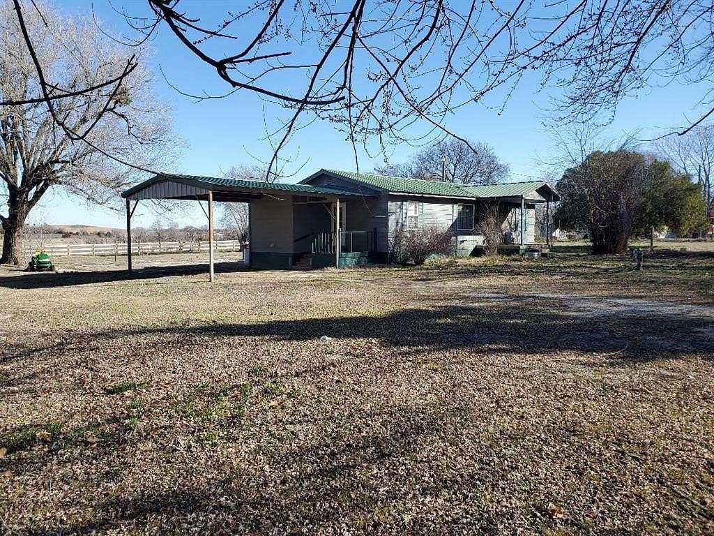 1.6 Acres of Residential Land with Home for Sale in Okemah, Oklahoma