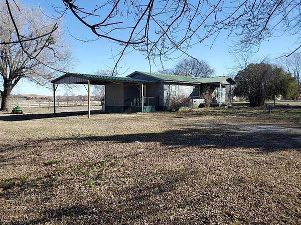 1.6 Acres of Residential Land with Home for Sale in Okemah, Oklahoma