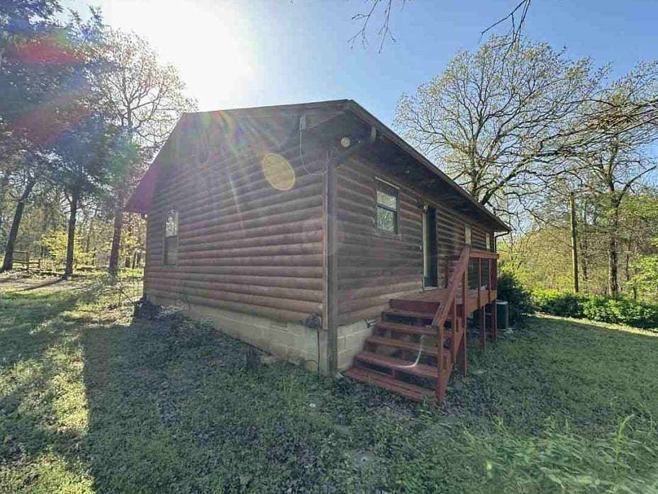 6 Acres of Residential Land with Home for Auction in Booneville, Arkansas