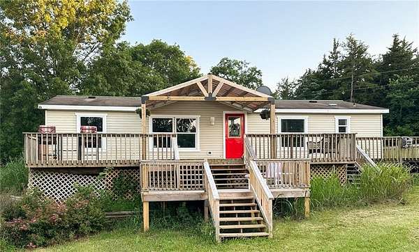 5 Acres of Residential Land with Home for Sale in Wheatland, Missouri