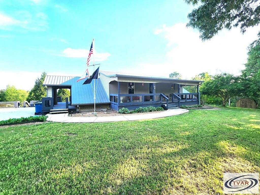 9.5 Acres of Residential Land with Home for Sale in Henry, Tennessee