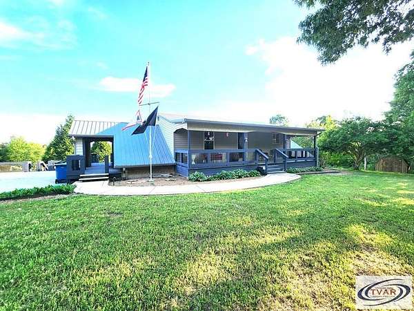 9.5 Acres of Residential Land with Home for Sale in Henry, Tennessee