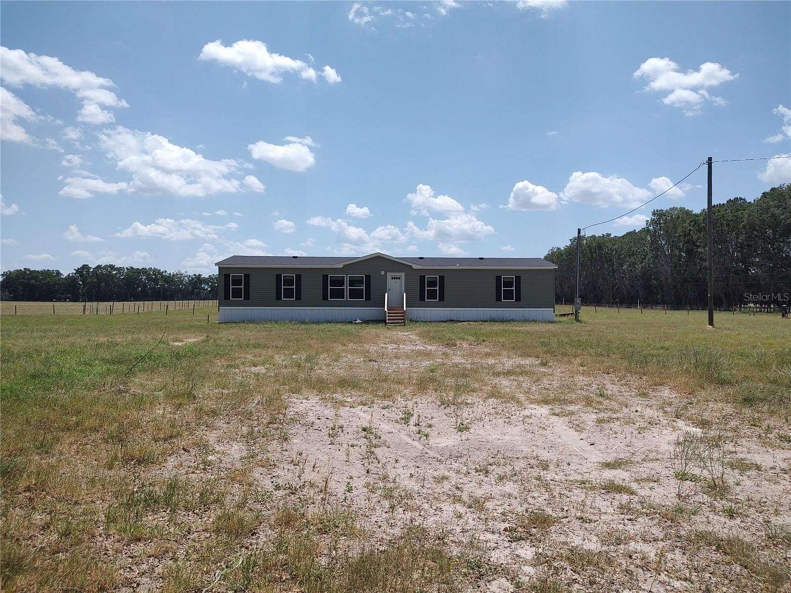 5 Acres of Residential Land with Home for Sale in Newberry, Florida