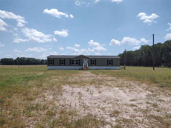 5 Acres of Residential Land with Home for Sale in Newberry, Florida