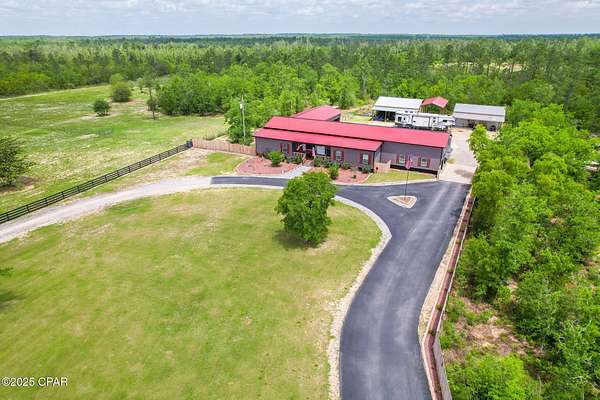 21.6 Acres of Agricultural Land with Home for Sale in Fountain, Florida