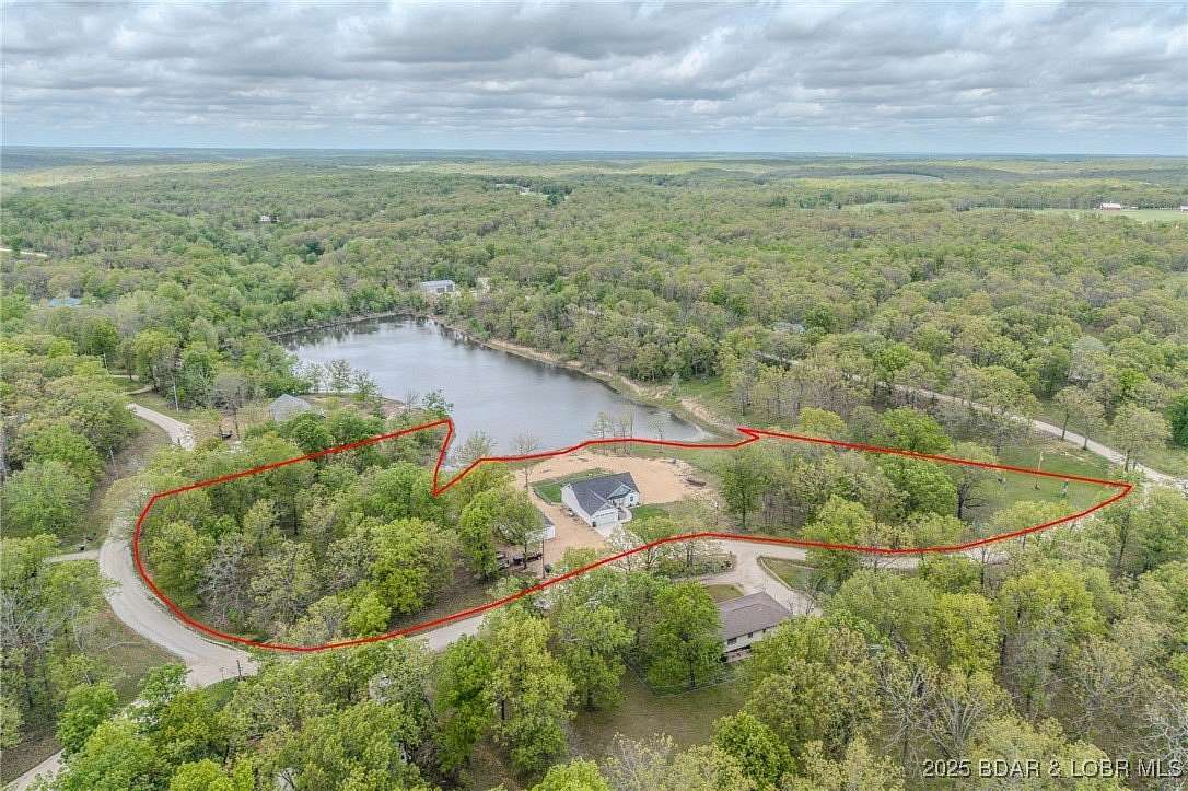 3.14 Acres of Residential Land with Home for Sale in Macks Creek, Missouri