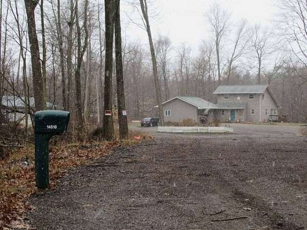 10.5 Acres of Land with Home for Sale in Otter Lake, Michigan