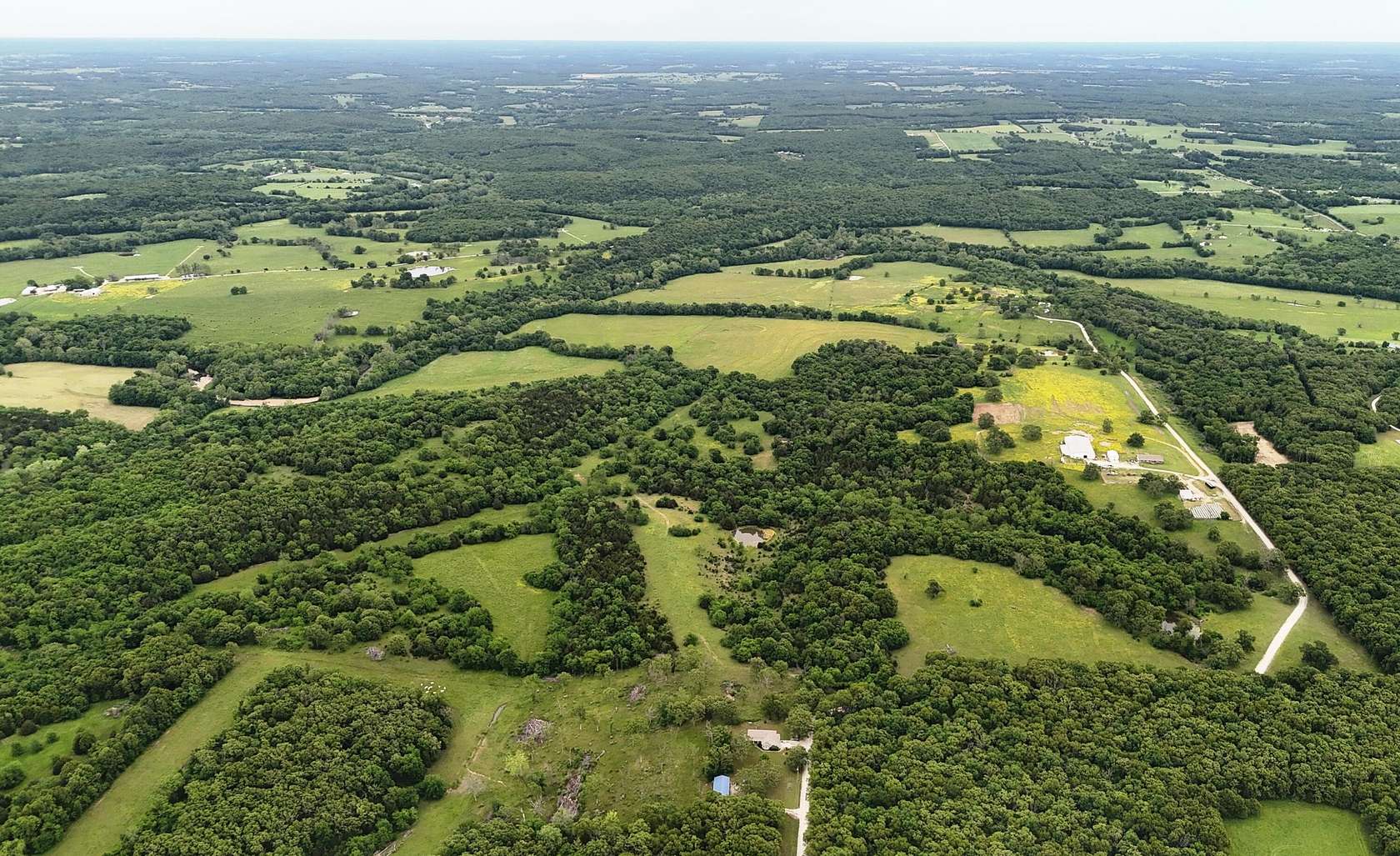 415 Acres of Agricultural Land with Home for Sale in Polk, Missouri