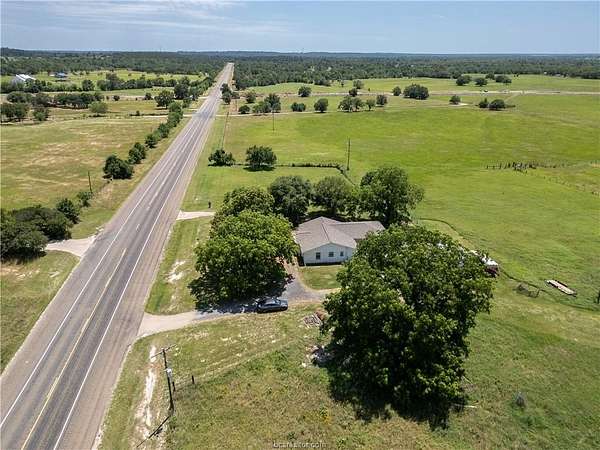 20 Acres of Agricultural Land with Home for Sale in Bedias, Texas
