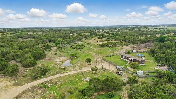 10 Acres of Residential Land with Home for Sale in Lipan, Texas