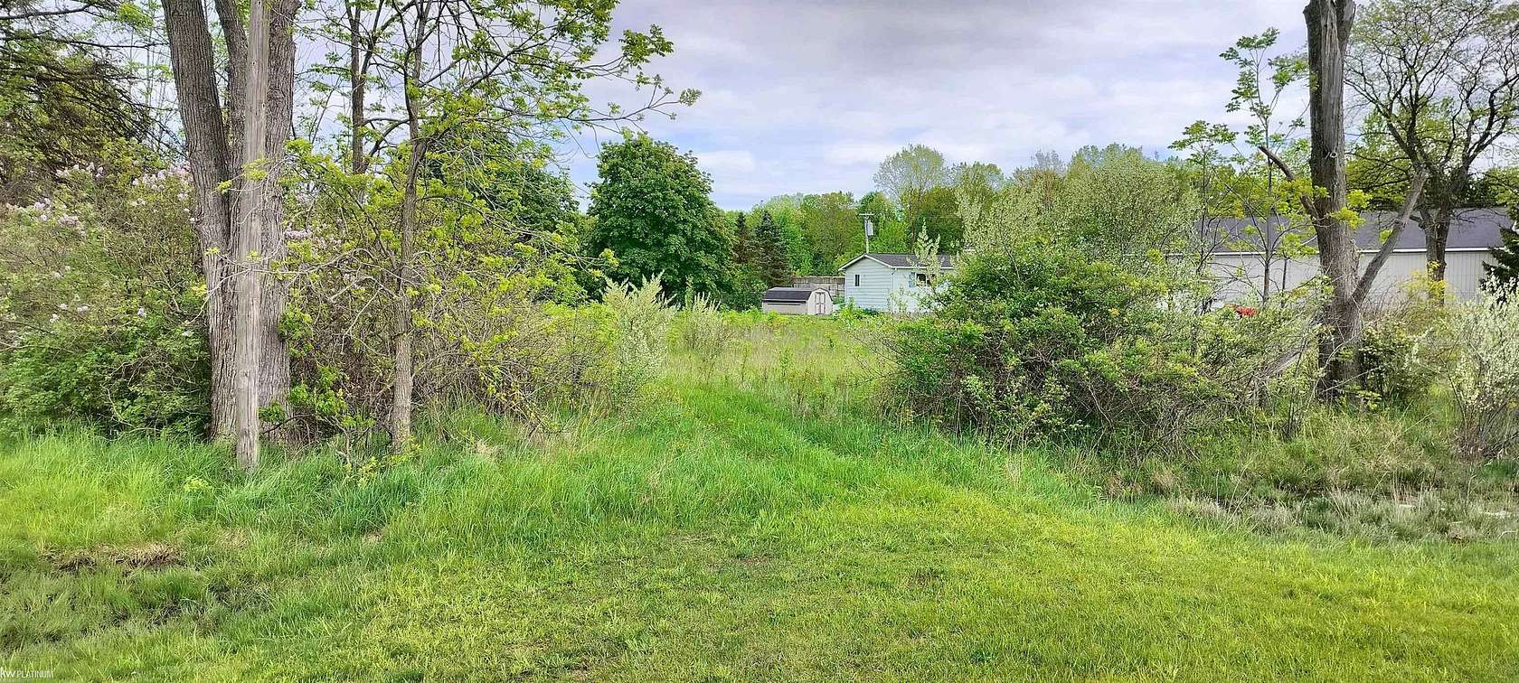 3.88 Acres of Commercial Land for Sale in Casco, Michigan