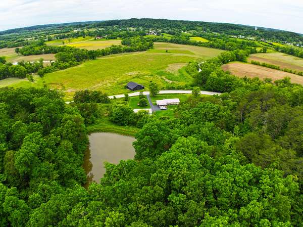 115 Acres of Land with Home for Sale in Irvine, Kentucky