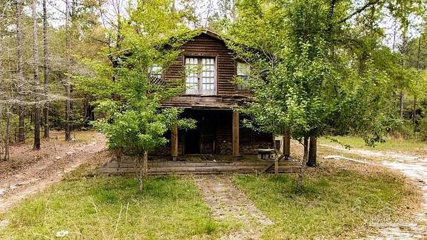 16 Acres of Recreational Land with Home for Sale in Jay, Florida