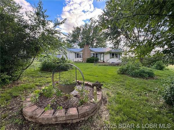 12 Acres of Land with Home for Sale in Versailles, Missouri