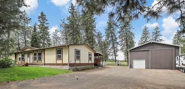 5.26 Acres of Residential Land with Home for Sale in Nine Mile Falls, Washington