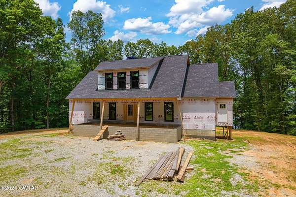 7.2 Acres of Residential Land with Home for Sale in Huntingdon, Tennessee