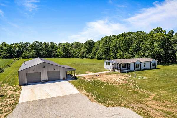 75 Acres of Agricultural Land with Home for Sale in Pleasant Hope, Missouri