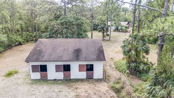 4.73 Acres of Residential Land with Home for Sale in Titusville, Florida