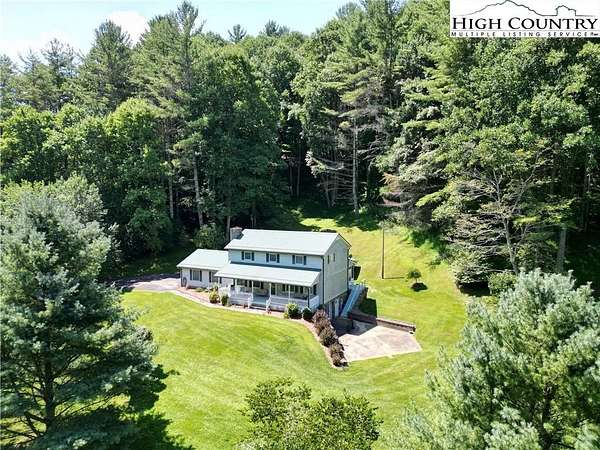 5.29 Acres of Land with Home for Sale in Lansing, North Carolina