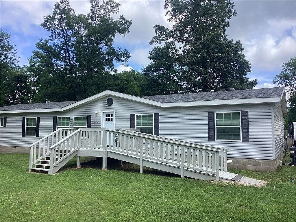 3.49 Acres of Land with Home for Sale in Garfield, Arkansas