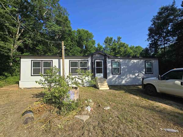 5.68 Acres of Residential Land with Home for Sale in Beckville, Texas