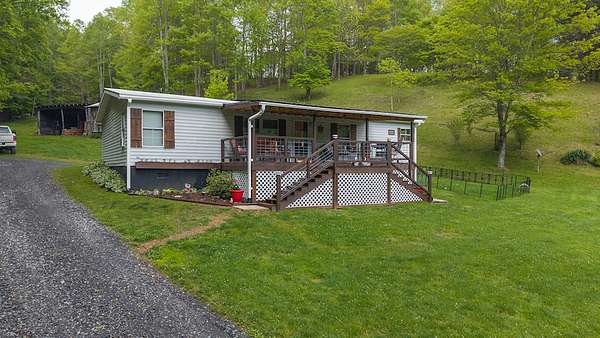 3.52 Acres of Residential Land with Home for Auction in Lansing, North Carolina