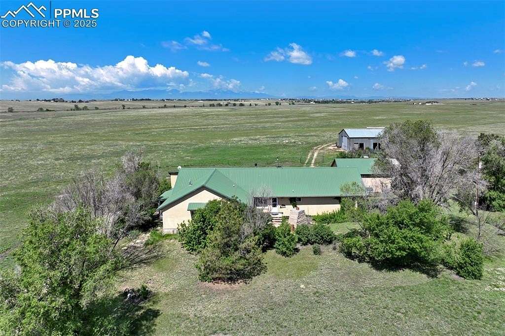 80 Acres of Agricultural Land with Home for Sale in Peyton, Colorado