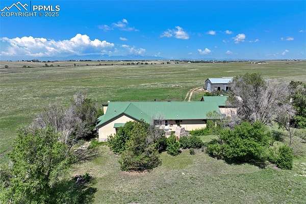 80 Acres of Agricultural Land with Home for Sale in Peyton, Colorado