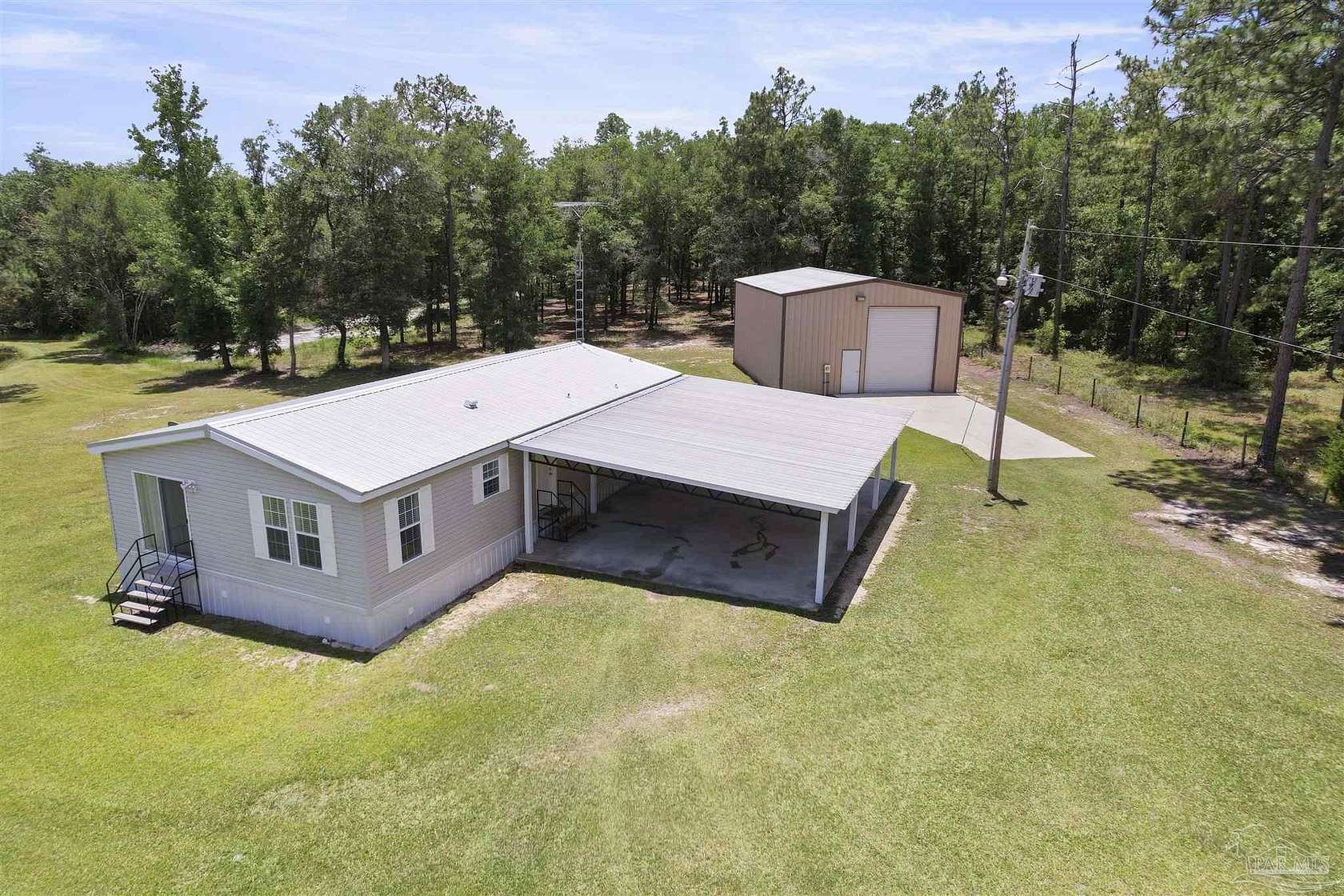 4.75 Acres of Residential Land with Home for Sale in Caryville, Florida