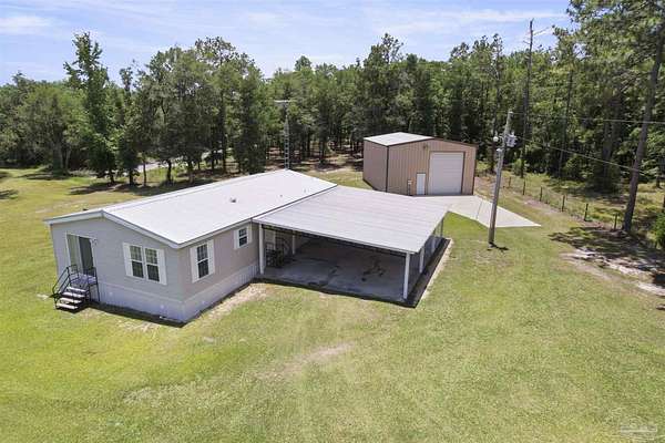 4.75 Acres of Residential Land with Home for Sale in Caryville, Florida