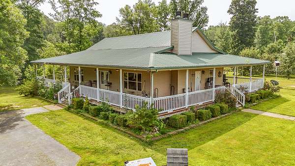 66.4 Acres of Land with Home for Sale in Hollow Rock, Tennessee