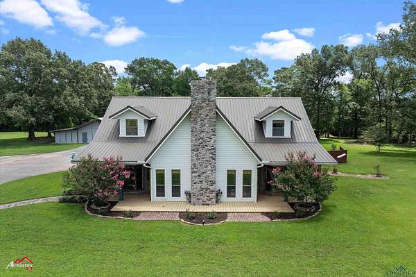 2.34 Acres of Residential Land with Home for Sale in Carthage, Texas