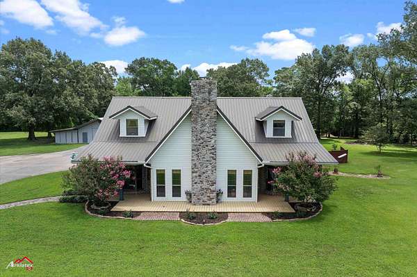 2.34 Acres of Residential Land with Home for Sale in Carthage, Texas