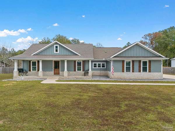 5 Acres of Residential Land with Home for Sale in Holt, Florida