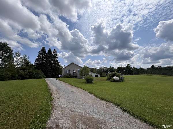 2.5 Acres of Residential Land with Home for Sale in Curran, Michigan