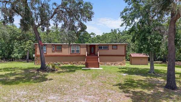 2.4 Acres of Residential Land with Home for Sale in Fanning Springs, Florida