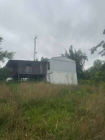 8.68 Acres of Residential Land with Home for Auction in Dunmor, Kentucky