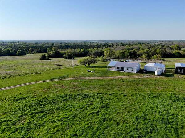 26.1 Acres of Agricultural Land with Home for Sale in Ben Franklin, Texas